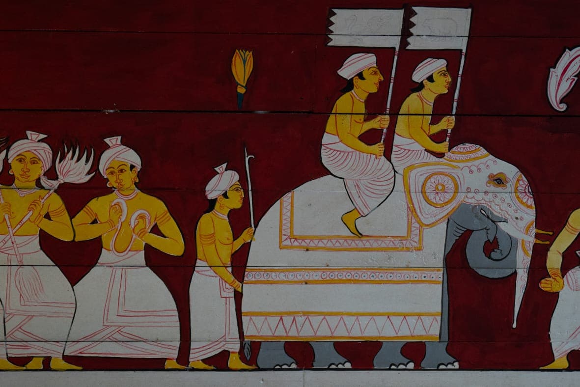 Hand-painted Sri Lankan mural depicting a royal procession with a decorated elephant